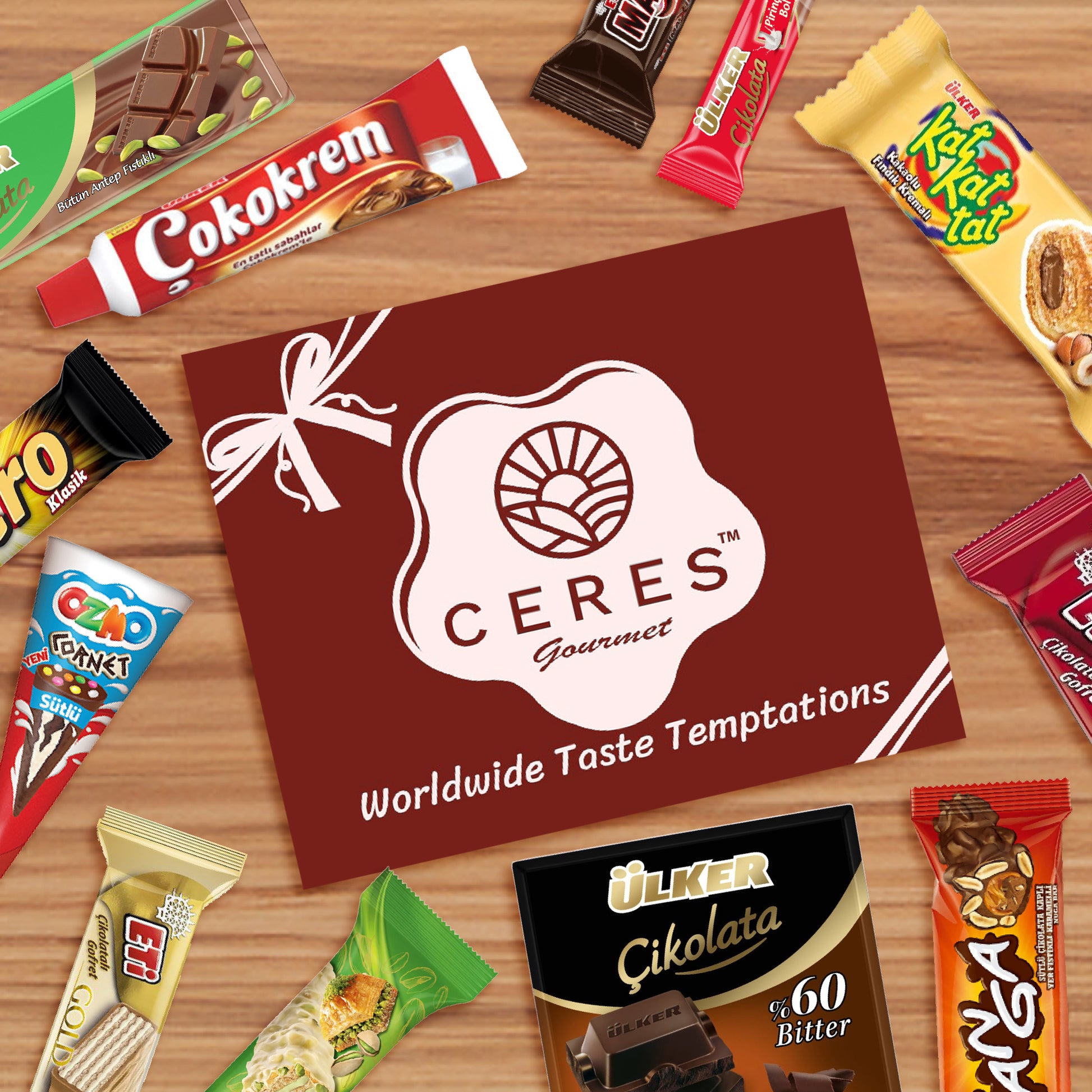 The Ceres Gourmet International Chocolate Variety Box 🍫21 Pieces, featuring assorted chocolates and vibrant packaging, is arranged around a brown card with the Ceres Gourmet logo and “Worldwide Taste Temptations” on a wooden surface.