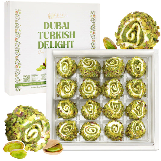 Ceres Gourmet Turkish Delight with Dubai Chocolate Filling – 17.6 oz: 16 round pistachio-coated sweets in a tray, with two cut open to reveal the tempting chocolate-filled center and rich pistachio coating.