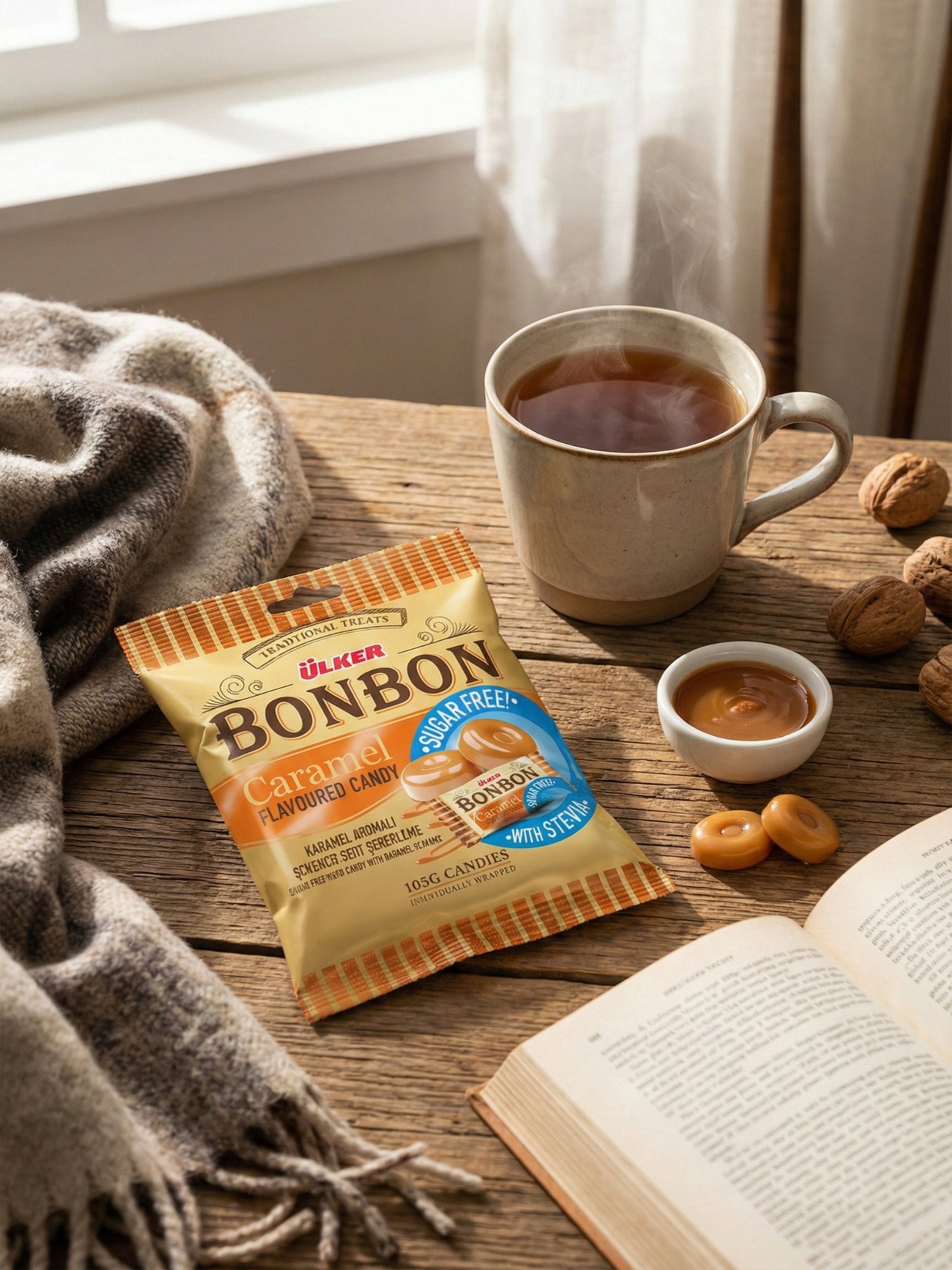 Packaged snack with a cup of tea, cookies, and an open book on a wooden table.