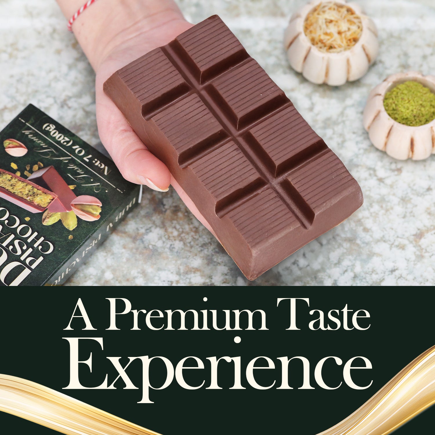 A hand holds a thick Ceres Gourmet Dubai Chocolate Pistachio Bar – 7oz (200g) above a Pistachio Chocolate box, surrounded by bowls of nuts. Text: A Premium Taste Experience with gourmet chocolate.