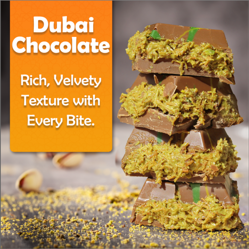 A stack of Ceres Gourmet Bulk Size Milky Dubai Chocolate Pistachio Bars (7oz, 50pcs) with green pistachio filling and scattered pistachios beside an orange sign: “Rich, Velvety Texture with Every Bite.”.