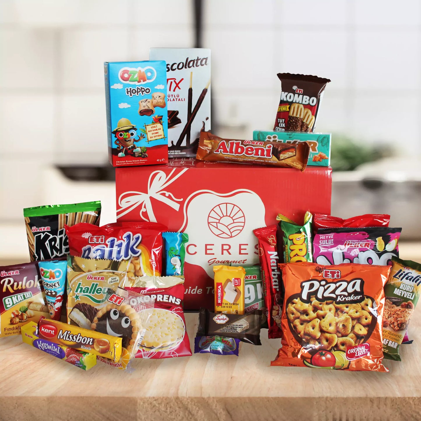 The 50-Pack International Snack Box by Ceres Gourmet features assorted treats in a red gift box with a white bow—perfect for employee appreciation or corporate gifting. Enjoy colorful snacks, chocolates, cookies, crackers, and sweets from around the world.