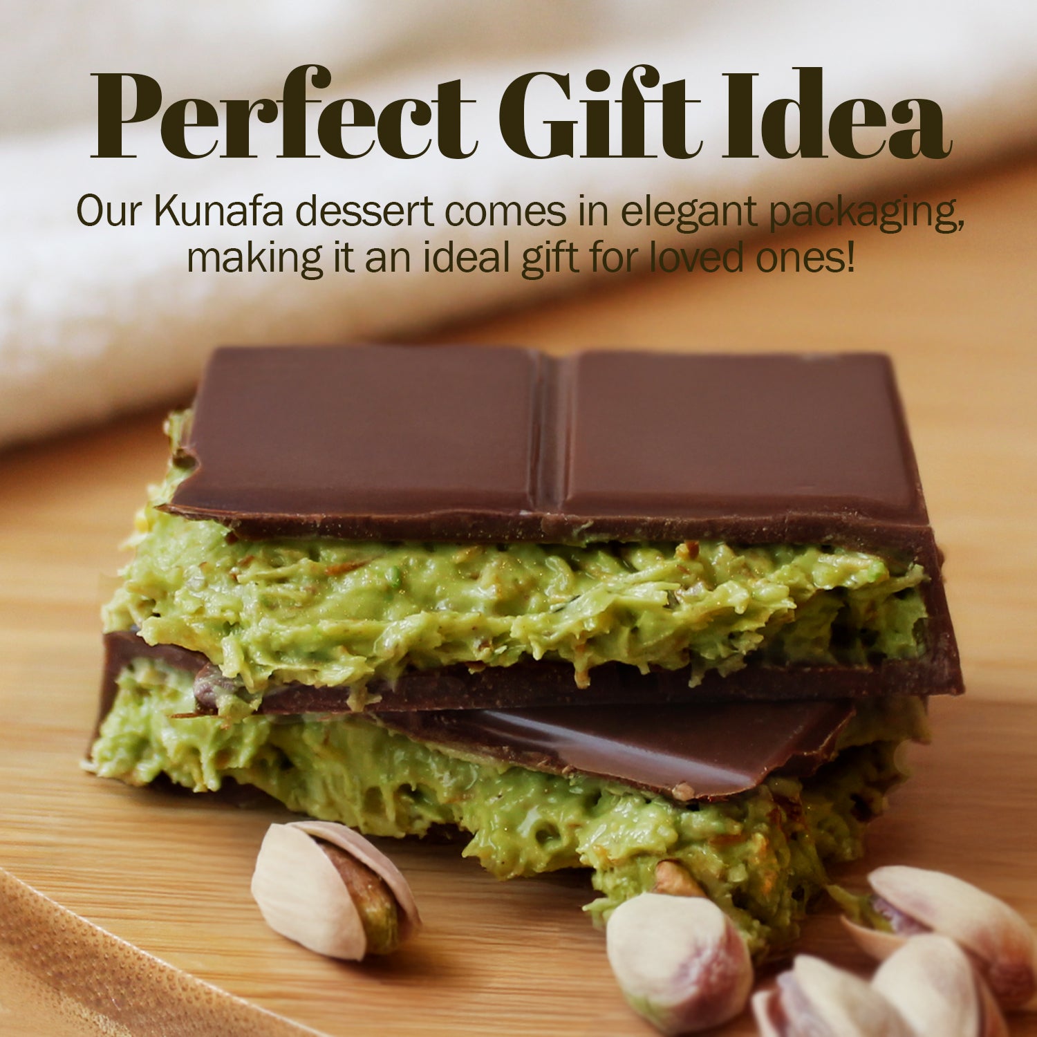 Two Ceres Gourmet Special Viral Dubai Chocolate Pistachio Bars (7oz) with green kunafa filling are stacked on wood. Whole pistachios surround them. The elegant box makes this pistachio chocolate a perfect gift idea.