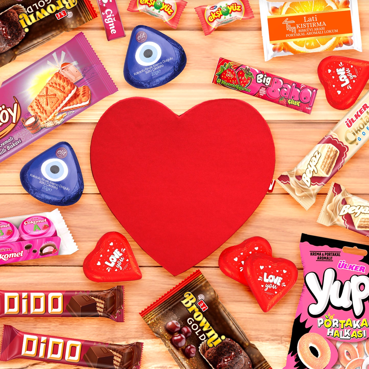 A red heart-shaped object sits on a wooden surface, surrounded by colorful Turkish candies and treats. The Ceres Gourmet Love Box International Snacks makes an ideal Valentines Day gift for those who love global flavors.