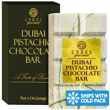 Ceres Gourmet White Chocolate Dubai Crispy Knafeh Pistachio Bar, 7oz (200g), in colorful packaging next to its black and gold box, with a Ships With Cold Pack label at the bottom right.