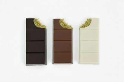 Three rectangular chocolate bars in different colors on a white background