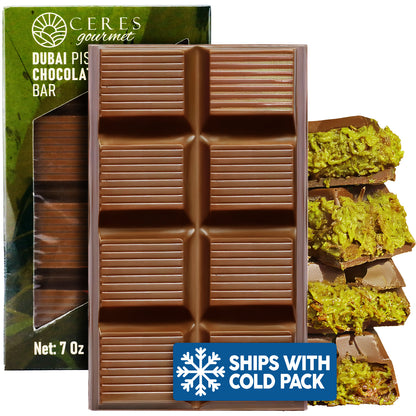 The Ceres Gourmet Crispy Dubai Chocolate Bar – 7 oz appears in front of green packaging. Broken pieces show a green pistachio filling, and a Ships with Cold Pack badge is displayed.