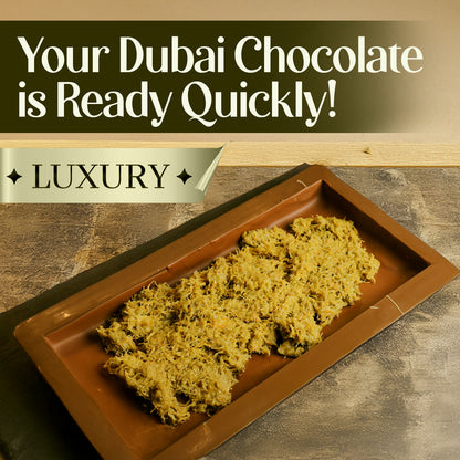 A rectangular brown tray displays a heap of Ceres Gourmet Pistachio Filling for Dubai Chocolate – 2.2 lb, with text above: Your Dubai Chocolate is Ready Quickly! LUXURY on a gold banner, set against neutral brown tones.