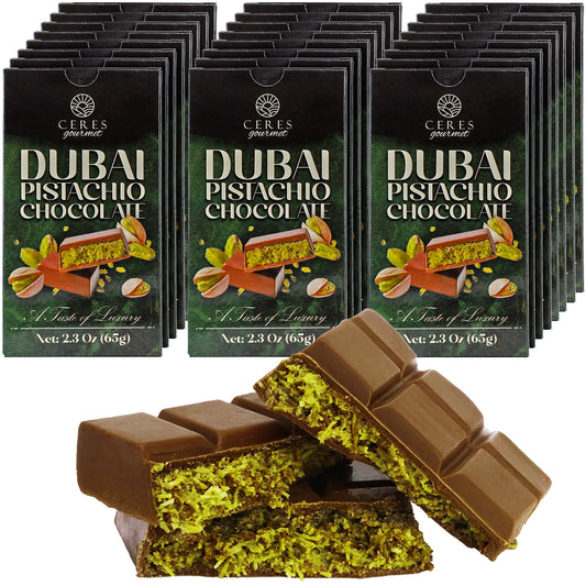A display of Ceres Gourmet Dubai Chocolate Bars 3-12-24-Pack, 2.3 oz each, in packaging, with two unwrapped bars in front showing rich chocolate filled with green pistachio pieces.