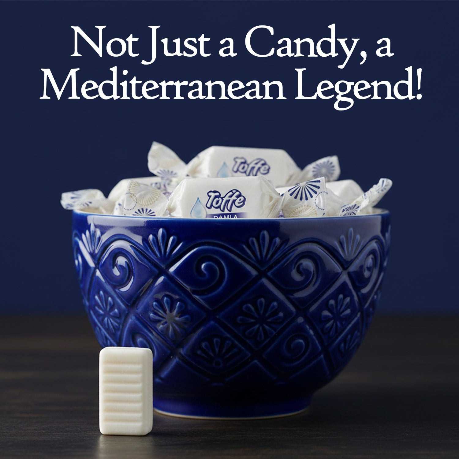 Blue bowl filled with white candy bars labeled 'Tuffe' on a dark background with text 'Not Just a Candy, a Mediterranean Legend!'.