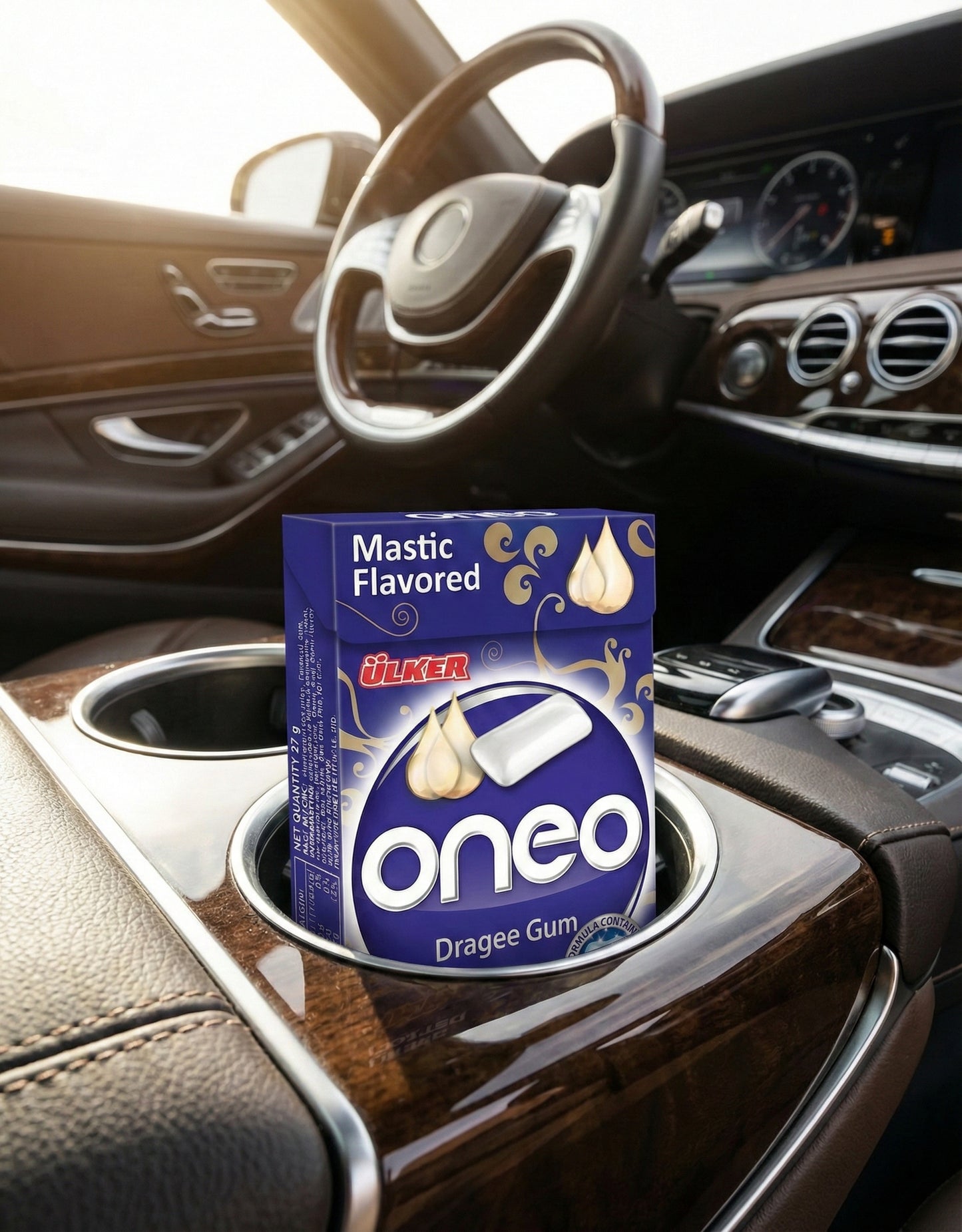 Box of oneo mastic flavored gum in a car cup holder