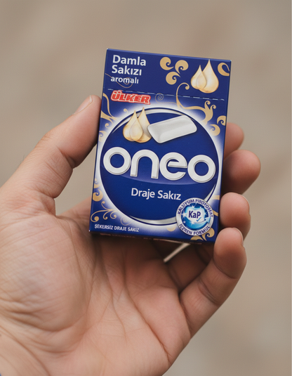 Hand holding a box of Oreo cookies with a blurred background