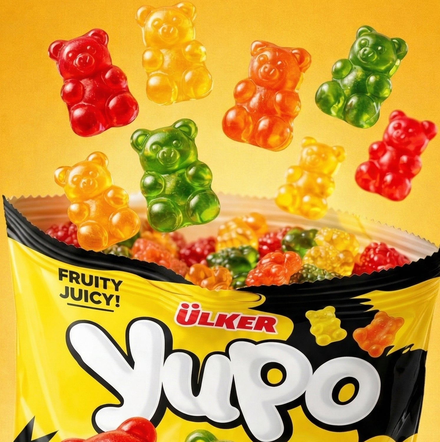 Colorful gummy bears spilling out of a Ulker Yupo package on a yellow background