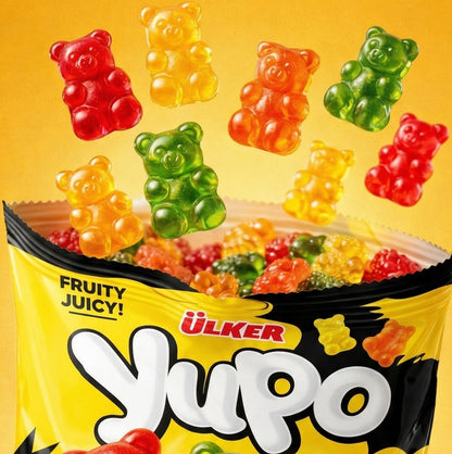 Colorful gummy bears spilling out of a Ulker Yupo package on a yellow background