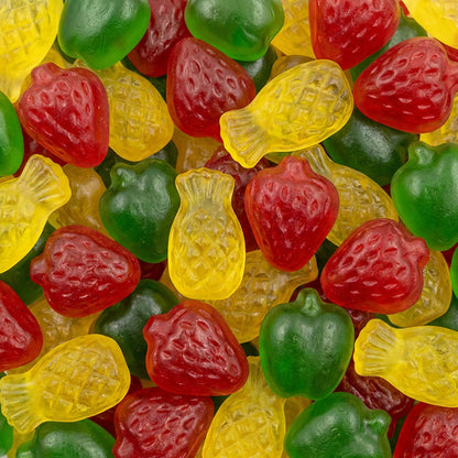 Assorted colorful gummy candies including red, green, and yellow shapes.