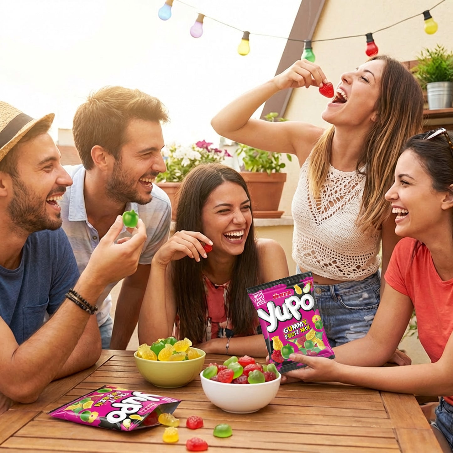 Group of friends enjoying Yupa gummy candies outdoors with a casual setting.