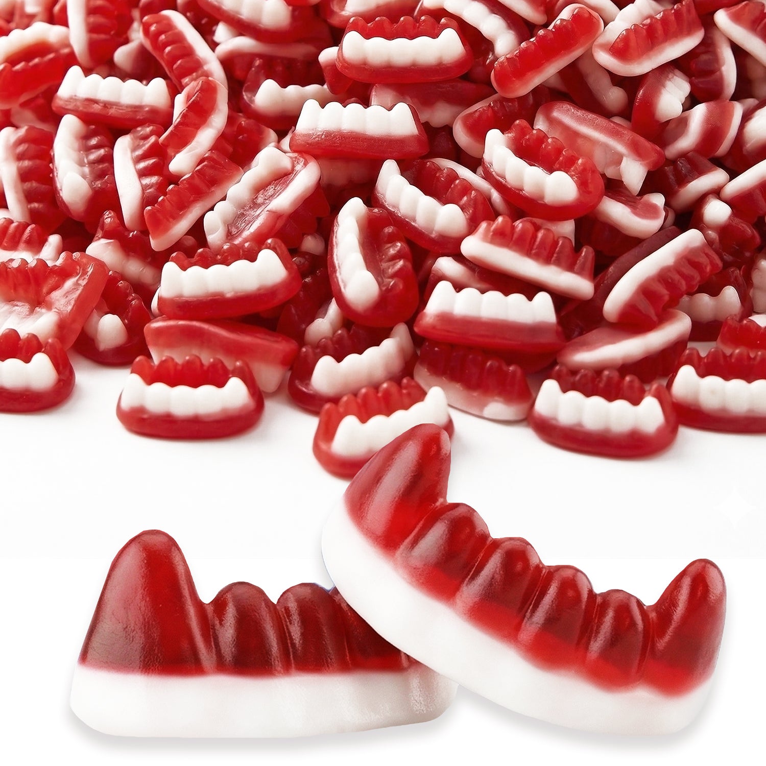 Red and white gummy candy shaped like teeth on a white background
