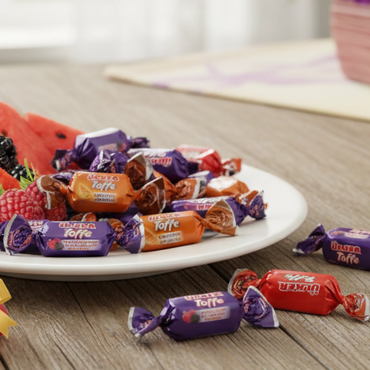 Assorted taffy candies on a plate with a blurred background