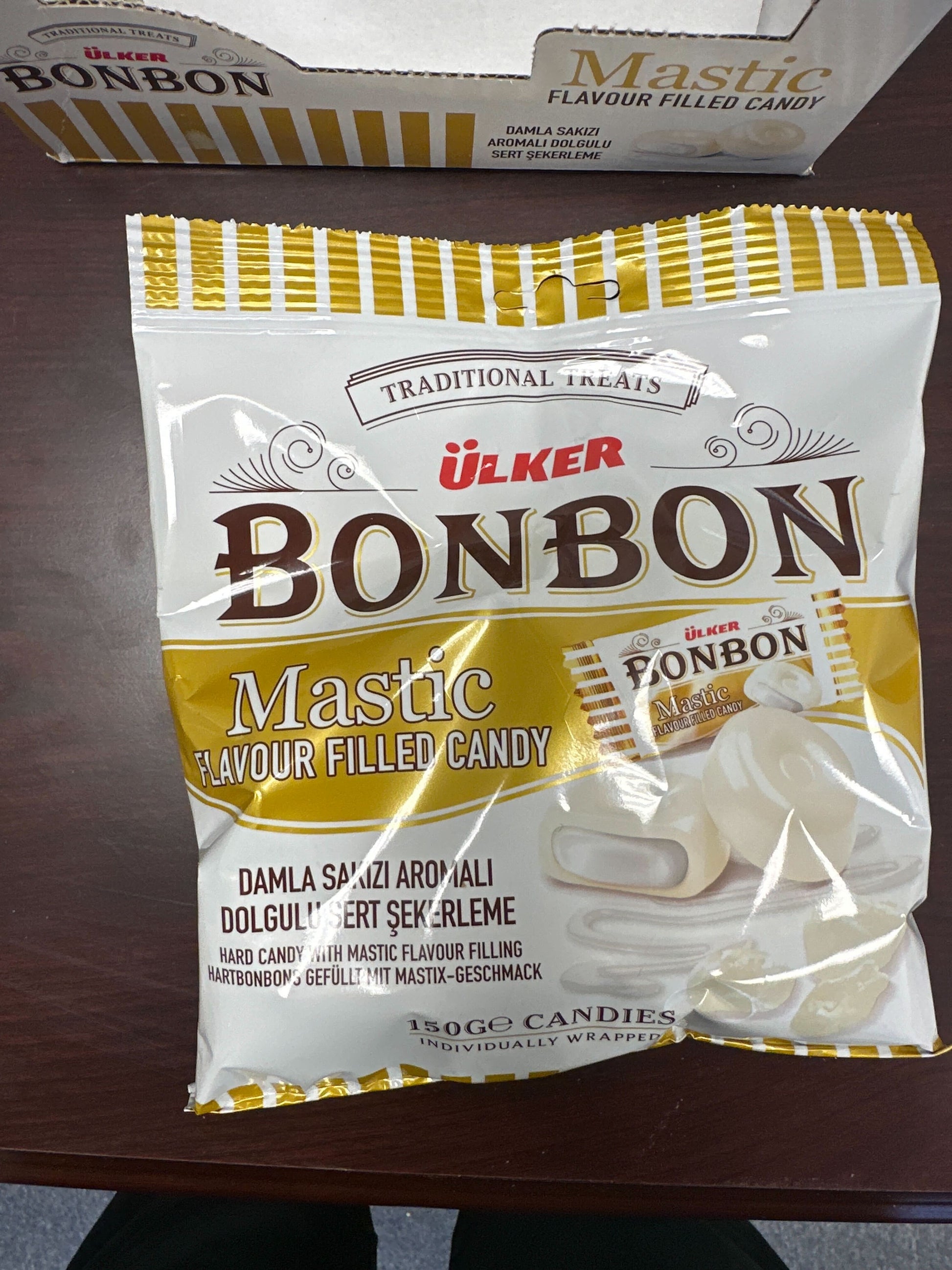 Ulker Bonbon Mastic flavor filled candy package on a wooden surface