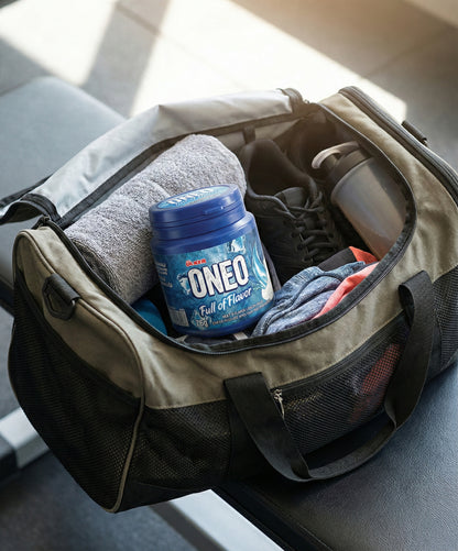 Open duffel bag with a container labeled 'ONEO' and other items on a surface.