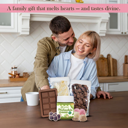 Man and woman in a kitchen with chocolate products on a counter, text about a family gift.