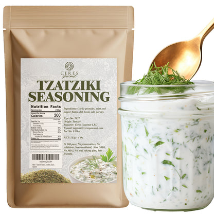 A Ceres Gourmet Authentic Greek Tzatziki Dip Spice Blend 4 oz package stands beside a jar of creamy Greek Tzatziki Dip topped with dill; a gold spoon is behind the jar. The package shows ingredients, nutrition facts, and product image.