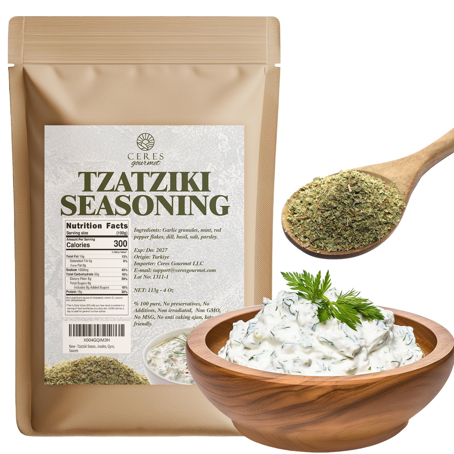 A Ceres Gourmet Authentic Greek Tzatziki Dip Spice Blend 4 oz package sits beside a wooden spoon with green seasoning and a bowl of creamy tzatziki dip topped with fresh dill.