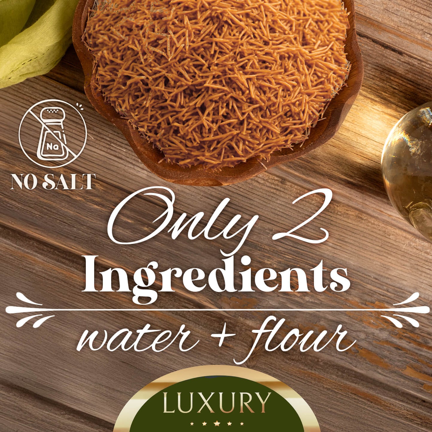 A bowl of Ceres Gourmet Baked & Chopped Kataifi (11-22-44 lb)—crafted from just water and flour—rests on wood. A glass of water and green cloth add luxury. Inspired by pre-cooked pastry, ideal for gourmet desserts. No salt added.