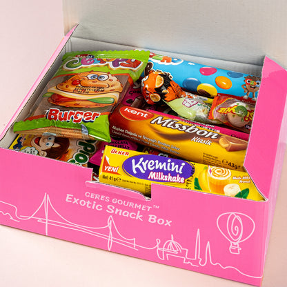 A Ceres Gourmet Candy Snacks Box Foreign Rare Unique 40 Mystery Candy 🍭 is open, showing a neat array of international wafers, cookies, candy bars, and a burger-shaped treat for a true exotic candy experience.