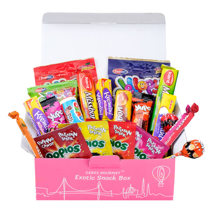 An open pink box labeled Candy Snacks Box Foreign Rare Unique 40 Mystery Candy by Ceres Gourmet displays assorted international candy—lollipops, gummies, and chocolate bars—upright for clear visibility.