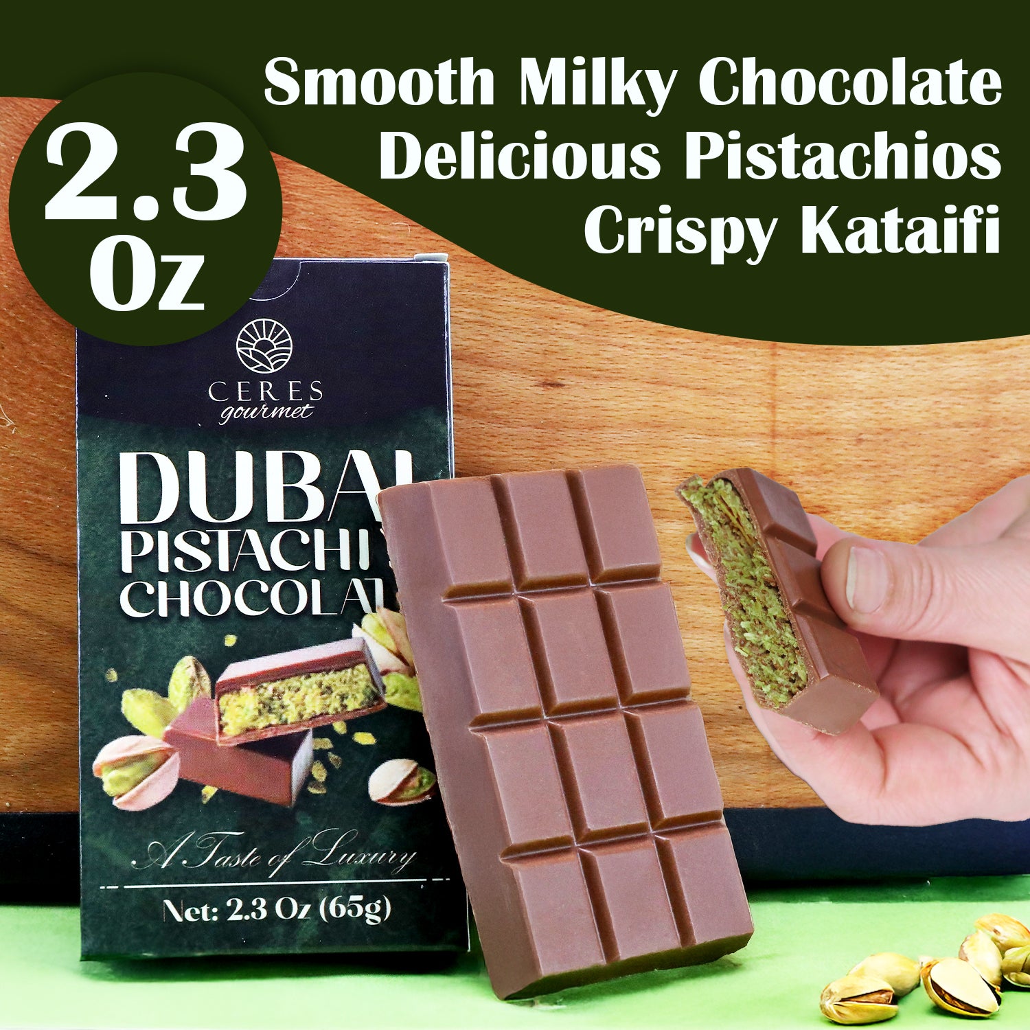A Ceres Gourmet Dubai Chocolate Bar (2.3 oz) is shown with its package, labeled “Dubai Pistachio Chocolate.” A hand reveals its layered pistachio, kataifi, and smooth chocolate interior—a true Knafeh Bar from the 3-12-24-Pack collection.