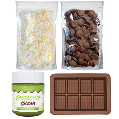 Four items—a bag of shredded pastry, a bag of chocolate discs, a jar of Pistachio Cream, and a silicone mold—everything you need to create the viral dessert with the Ceres Gourmet Dubai Chocolate Bar DIY Set (Milky, Dark, or White Chocolate).