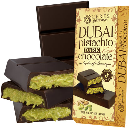 Ceres Gourmet's Dubai Chocolate Kataifi and Pistachio features dark, white, and milky chocolate with a green pistachio filling. The 3.5 oz bar comes in gold packaging adorned with pistachios, evoking Middle Eastern luxury.