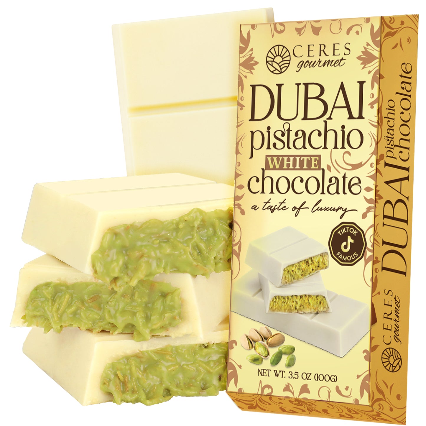 A box of Ceres Gourmet Dubai Chocolate Kataifi and Pistachio – Gold Package is displayed beside chocolate bars with green pistachio cream, highlighting Middle Eastern flavors and pistachio-themed packaging.