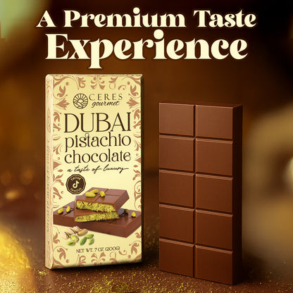 A Ceres Gourmet Dubai Chocolate Kunafa Pistachio Indulge in the Irresistible Delight 7oz Bar stands upright with gold and cream packaging, featuring chocolate and pistachios. Above, large text states: “A Premium Taste Experience.”.