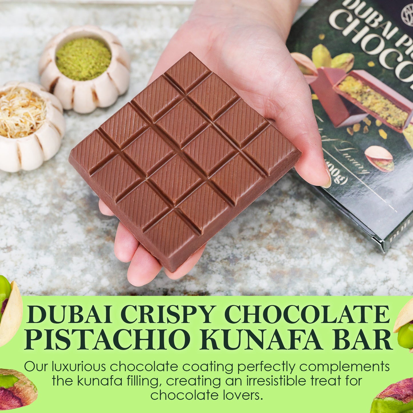 A hand holds the Ceres Gourmet Dubai Chocolate Pistachio Bar Mlky Chocolate & Crispy Knafeh (3.5oz), with pistachios, kunafa, and a gift box nearby—an ideal gourmet chocolate gift for unique flavor lovers.