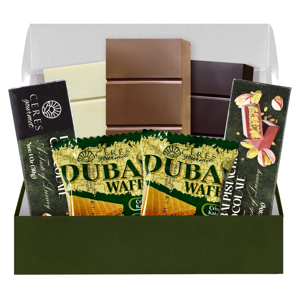 Assorted chocolate bars and wafers in a box with visible branding.
