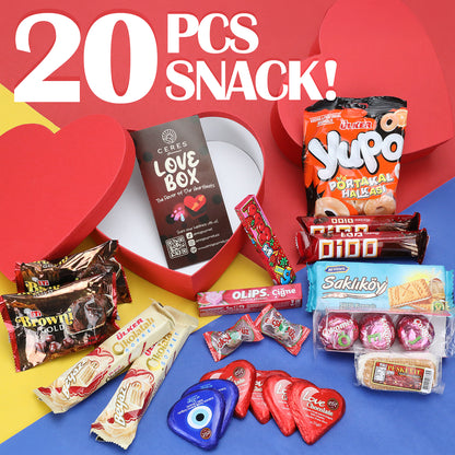 The Ceres Gourmet Love Box International Snacks for Your Special Someone 💖 features 20 assorted global treats—chocolates, wafers, and candy—in a red heart-shaped box. “20 PCS SNACK!” is displayed on a vibrant background; perfect for Valentine’s Day!.