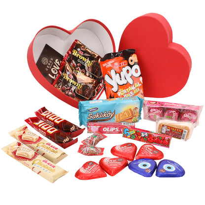 The Love Box International Snacks for Your Special Someone 💖 by Ceres Gourmet features a red heart-shaped box filled with assorted chocolates, cookies, wafers, and candies—an ideal Valentines Day gift with treats elegantly displayed and the lid propped open.
