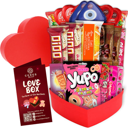 The Love Box International Snacks for Your Special Someone 💖 by Ceres Gourmet features assorted Turkish chocolate bars, candies, and cookies in a red heart-shaped box with a LOVE BOX card—an ideal Valentine’s Day gift for snack lovers.