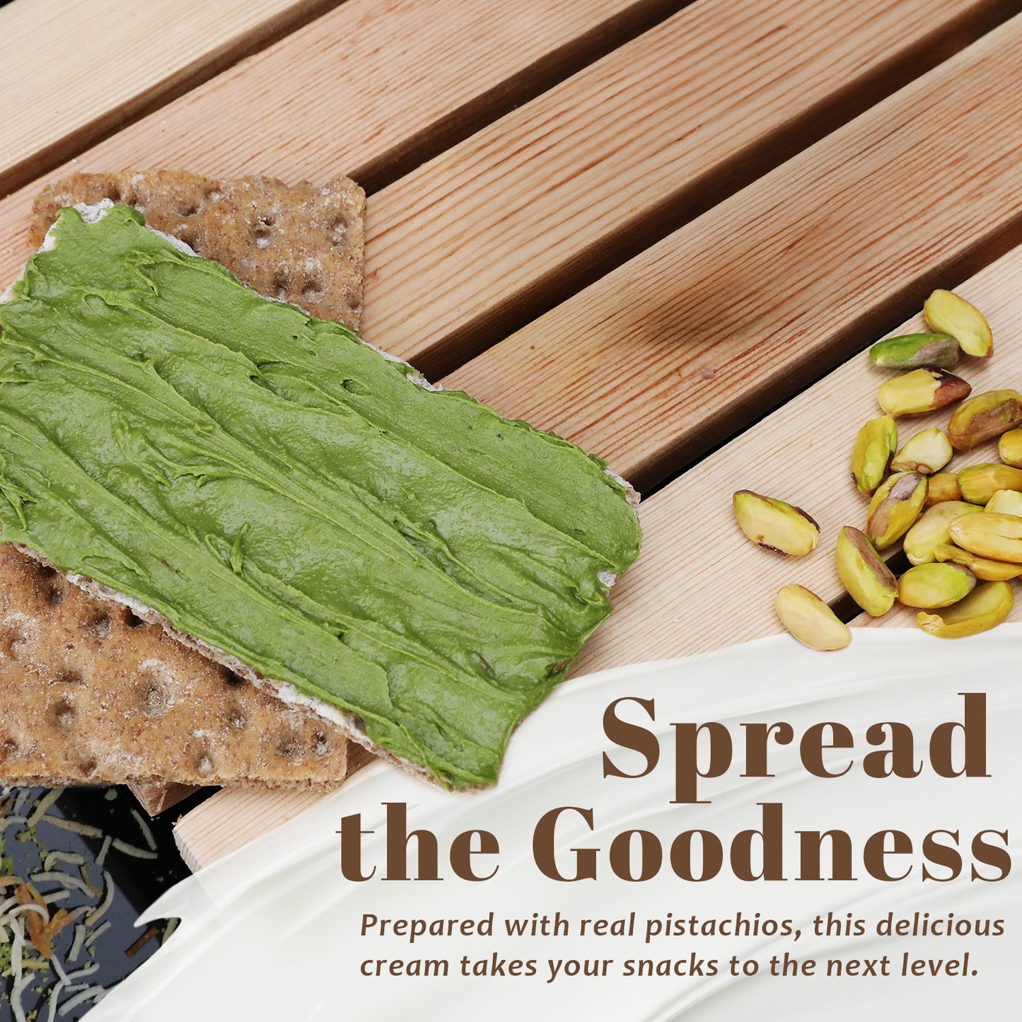 Two crispbread crackers on wood, one topped with Ceres Gourmet Professional Pistachio Cream. Shelled pistachios scattered nearby. Text: Spread the Goodness. Made with real pistachios for chocolate, brownies, pancakes & more (2.2/6.6/11 lb).