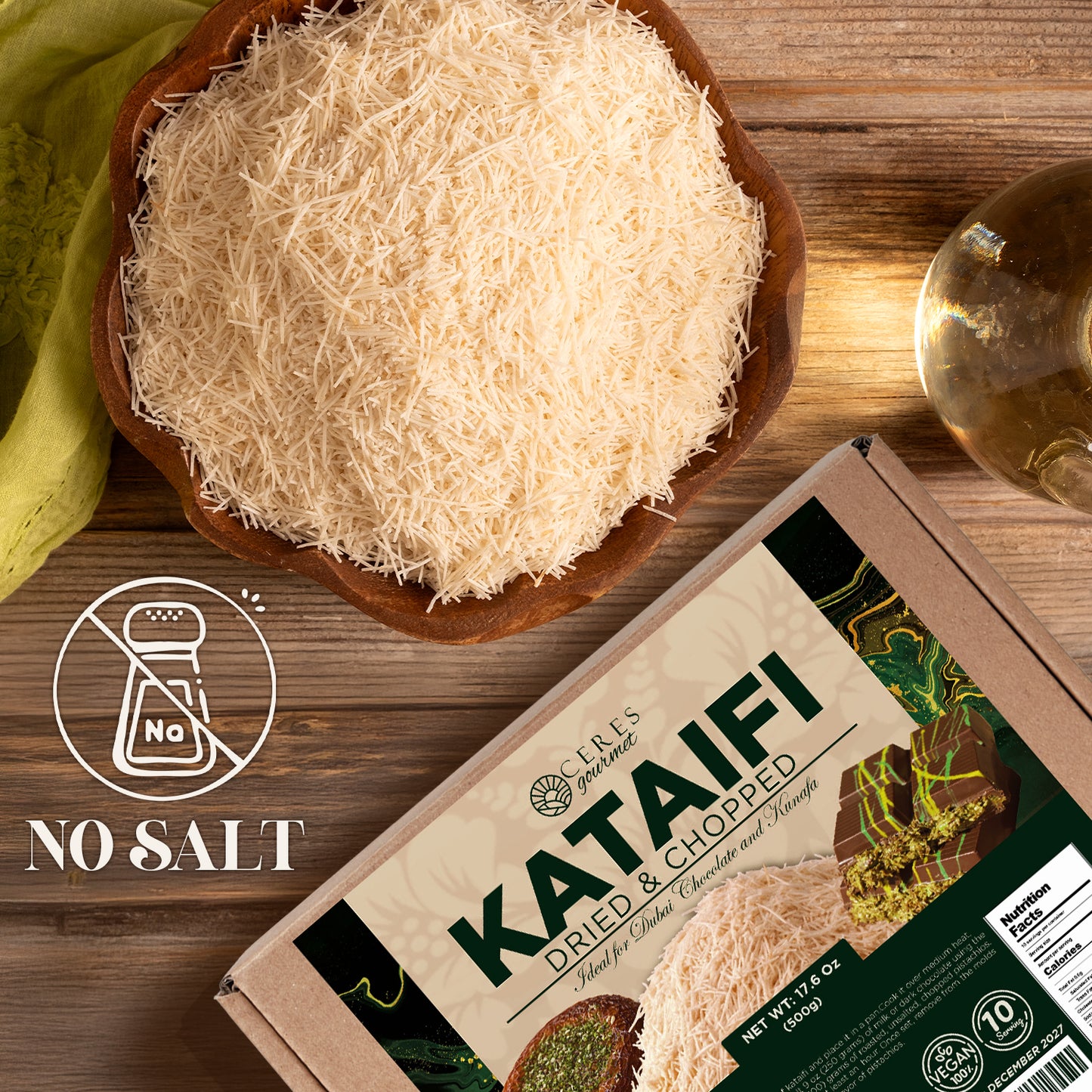 A bowl of Ceres Gourmet Shredded Kataifi – Authentic, Versatile & Ready-to-Use 1.1 lb sits on a wooden table beside its box. A No Salt icon highlights that this Turkish pastry contains no added salt.