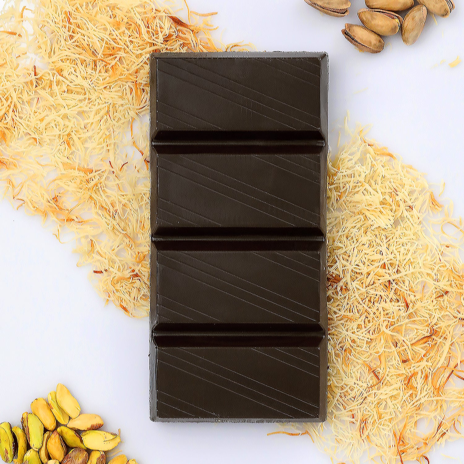 The Ceres Gourmet Viral Dubai Chocolate Bar Dark 75% Pistachio 7 oz features rich dark chocolate atop shredded pastry, garnished with pistachios and whole nuts on a white background—a luxurious treat for chocolate lovers.
