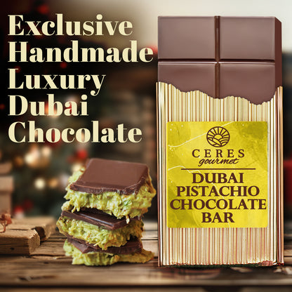 A Ceres Gourmet Special Viral Dubai Chocolate Pistachio Bar 7oz with Elegant Box stands upright in golden packaging. Stacked pieces show a green pistachio and kunafa filling. Text: Exclusive Handmade Luxury Dubai Chocolate.